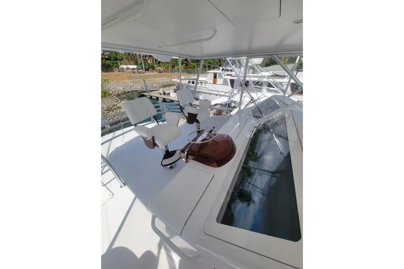  Yacht Photos Pics Flybridge of 2012 Viking 64c yacht with helm chairs and controls.