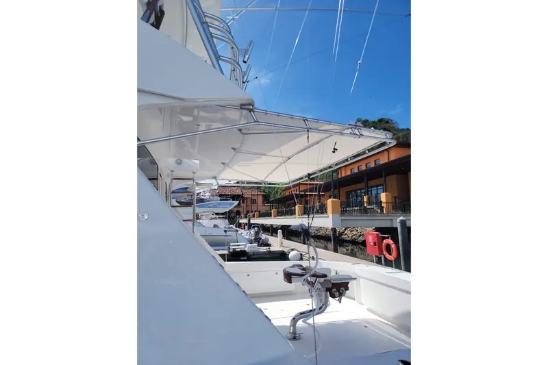  Yacht Photos Pics 2012 Viking 64c yacht docked, showcasing sleek design and fishing equipment under a clear blue sky.