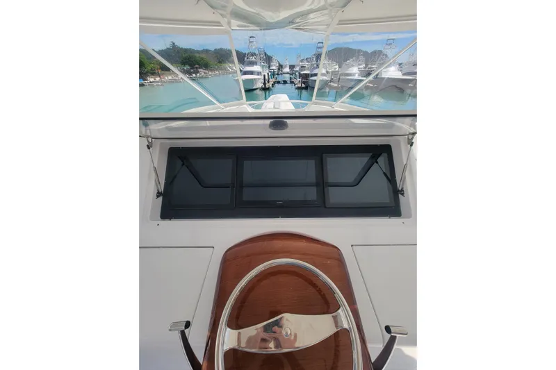  Yacht Photos Pics 2012 Viking 64c yacht helm with marina view in the background.