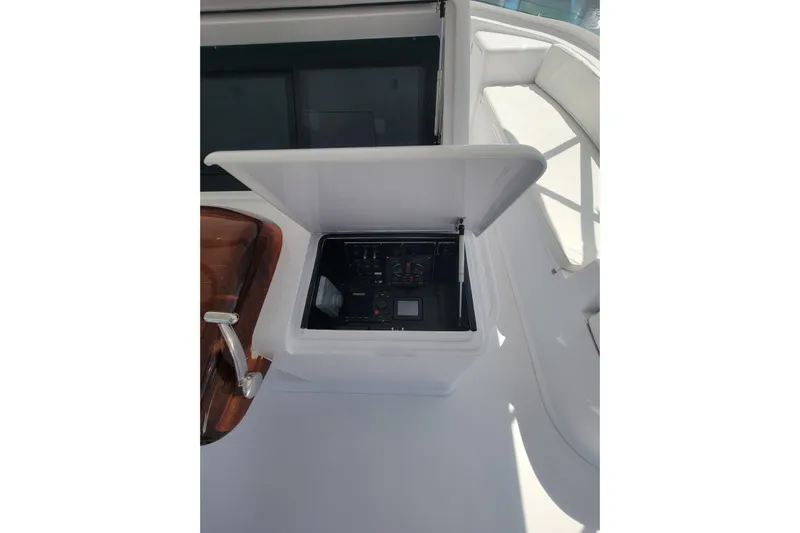  Yacht Photos Pics 2012 Viking 64c yacht control panel with open cover, showcasing navigation instruments.