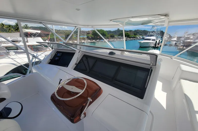  Yacht Photos Pics Helm of 2012 Viking 64c yacht with marina view.