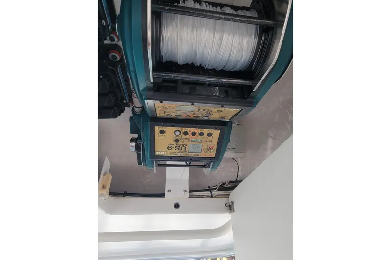  Yacht Photos Pics Fishing reel equipment on a 2012 Viking 64c boat, featuring control panel and line spool.