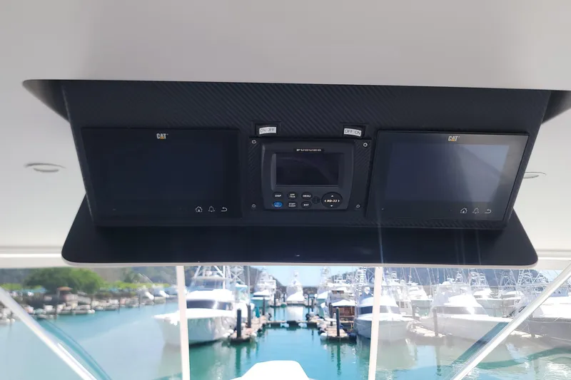  Yacht Photos Pics Viking 64c 2012 yacht dashboard with navigation screens and marina view.