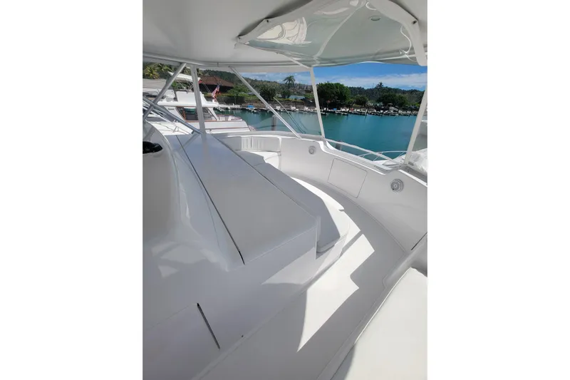  Yacht Photos Pics Luxurious 2012 Viking 64c yacht interior with sleek white seating and scenic marina view.