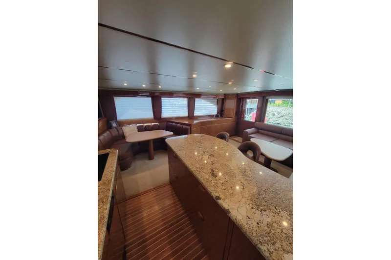  Yacht Photos Pics Luxurious interior of 2012 Viking 64c yacht with elegant seating and granite countertops.