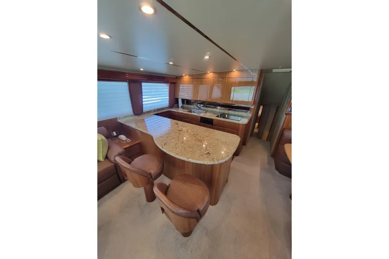  Yacht Photos Pics Luxurious interior of 2012 Viking 64c yacht with elegant wood and granite finishes.