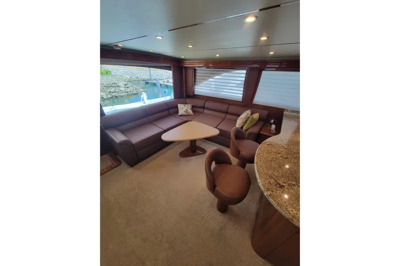  Yacht Photos Pics Luxurious interior of 2012 Viking 64c yacht with plush seating and elegant decor.