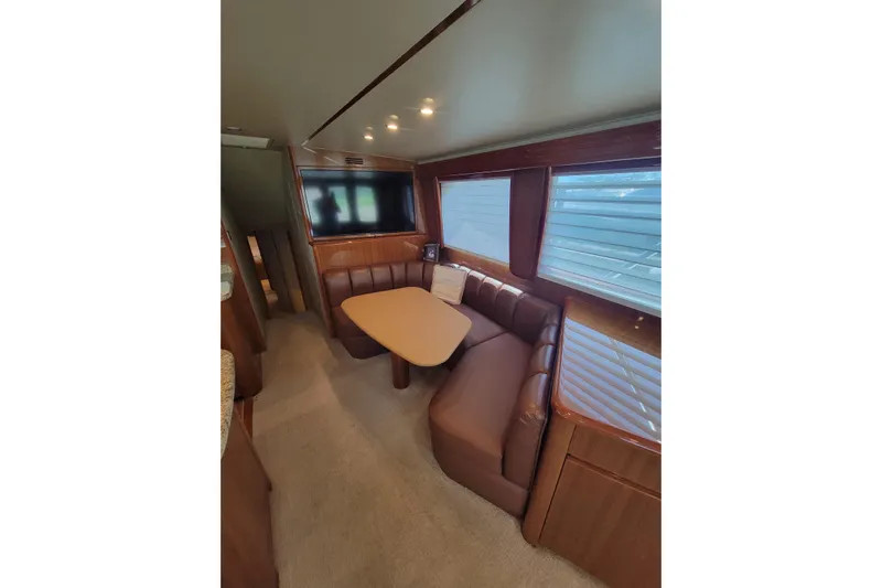  Yacht Photos Pics Interior of 2012 Viking 64c yacht with dining area and large windows.