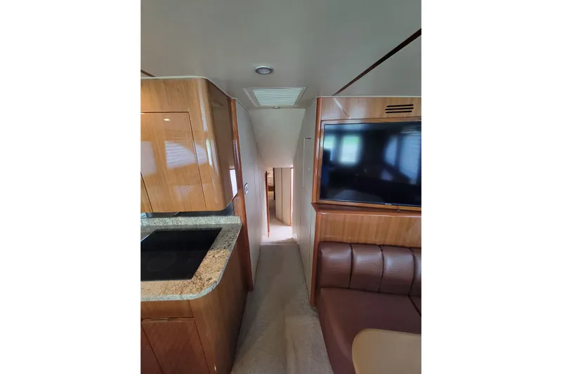  Yacht Photos Pics Interior of 2012 Viking 64c yacht with modern kitchen and seating area.