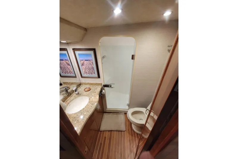  Yacht Photos Pics Luxurious bathroom in 2012 Viking 64c yacht with granite countertop and shower.
