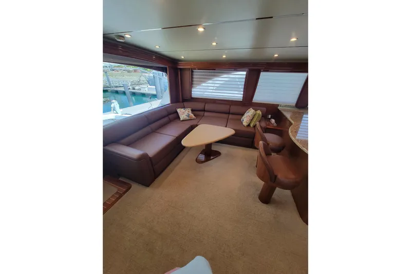  Yacht Photos Pics Luxurious interior of 2012 Viking 64c yacht with plush seating and elegant decor.