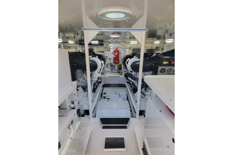  Yacht Photos Pics Engine room of 2012 Viking 64c yacht, featuring dual engines and control panels.