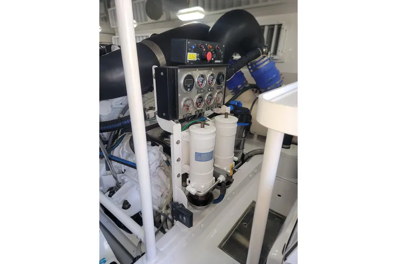  Yacht Photos Pics Engine room of a 2012 Viking 64c yacht, featuring control panel and filters.