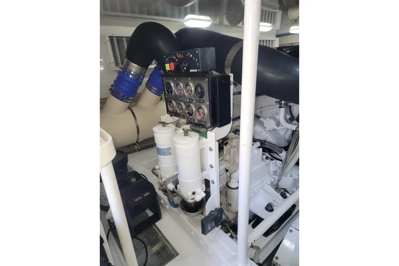  Yacht Photos Pics Engine room of a 2012 Viking 64c yacht, featuring gauges and filters.