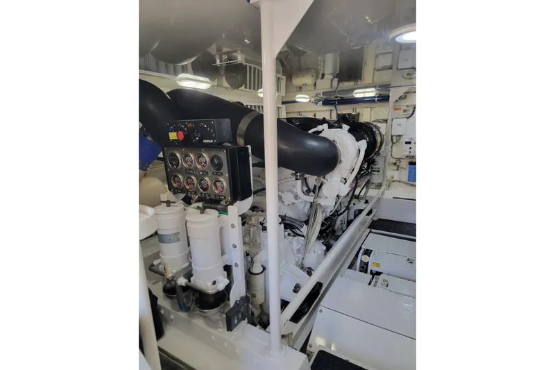  Yacht Photos Pics Engine room of a 2012 Viking 64c yacht, featuring gauges and machinery.