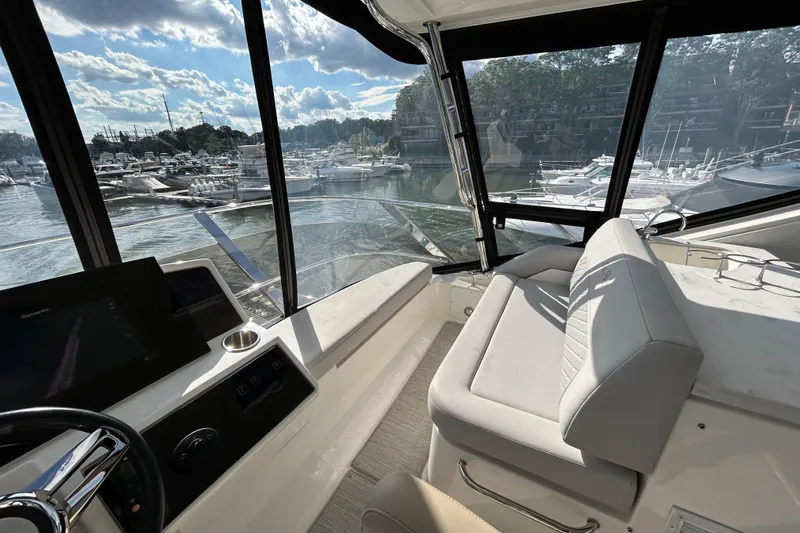  Yacht Photos Pics Interior view of 2018 Sea Ray Fly 520 yacht with marina backdrop.