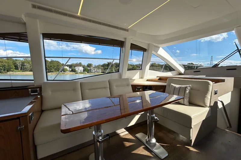  Yacht Photos Pics Luxurious interior of 2018 Sea Ray Fly 520 yacht with elegant seating and scenic views.