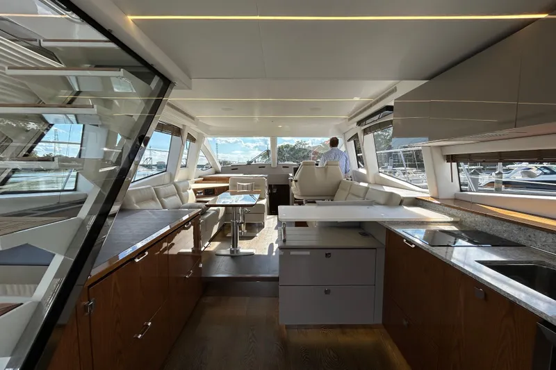  Yacht Photos Pics Luxurious interior of 2018 Sea Ray Fly 520 yacht with modern kitchen and seating area.