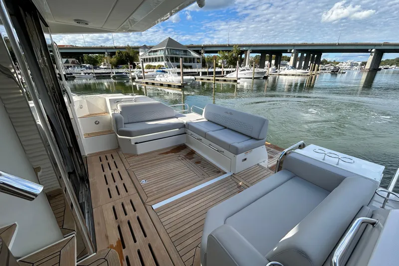  Yacht Photos Pics Luxurious 2018 Sea Ray Fly 520 yacht with spacious deck and modern seating at marina.