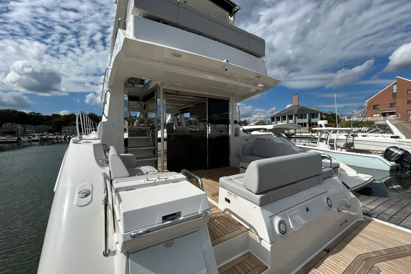  Yacht Photos Pics Luxurious 2018 Sea Ray Fly 520 yacht docked, featuring spacious deck and modern design.
