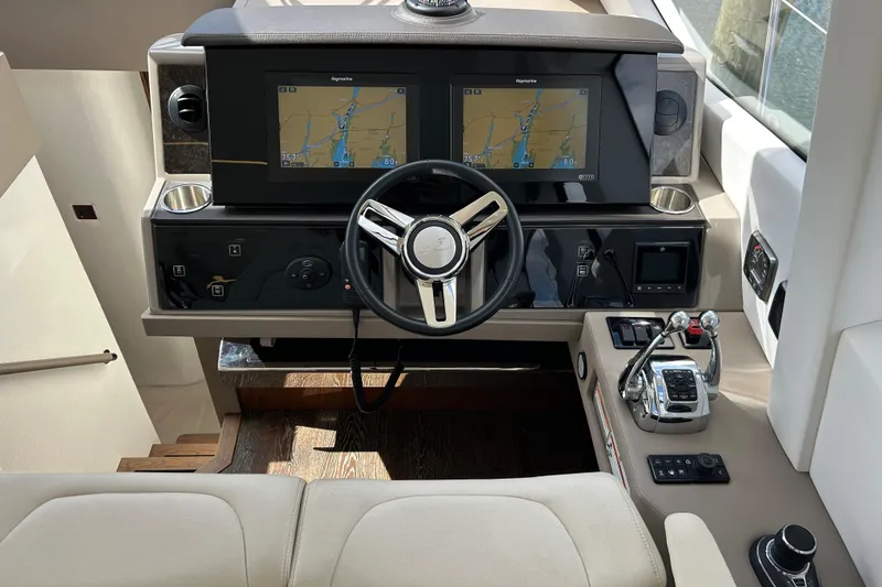  Yacht Photos Pics 2018 Sea Ray Fly 520 helm with dual navigation screens and modern controls.