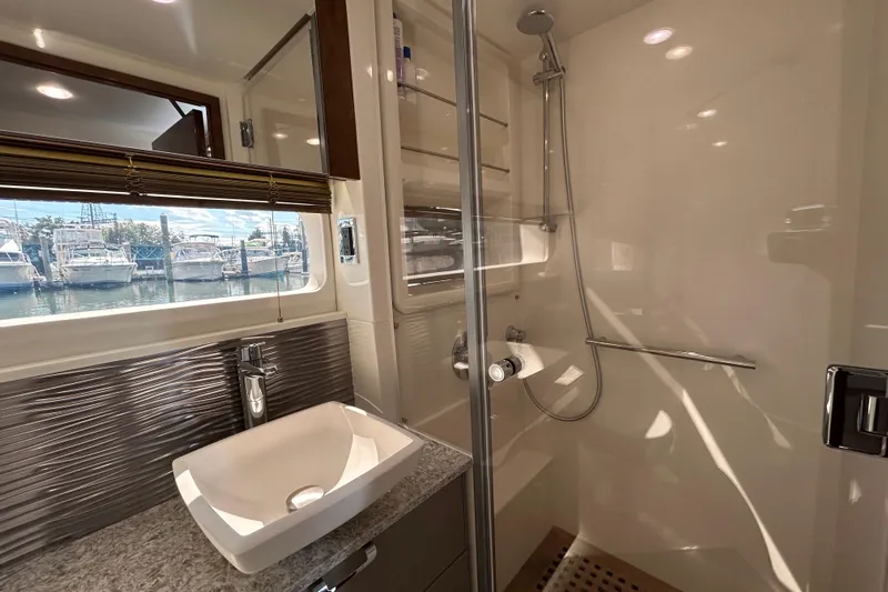  Yacht Photos Pics Luxurious bathroom interior of 2018 Sea Ray Fly 520 yacht with modern fixtures.