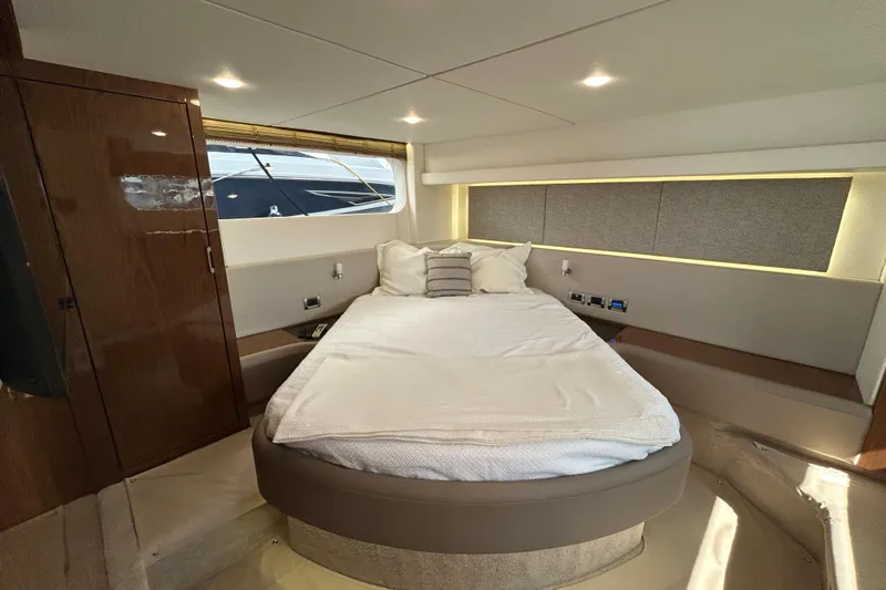  Yacht Photos Pics Luxurious bedroom interior of 2018 Sea Ray Fly 520 yacht with modern design.
