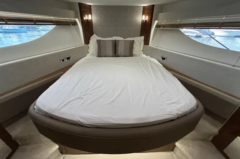  Yacht Photos Pics Luxurious bedroom interior of 2018 Sea Ray Fly 520 yacht with elegant bedding.