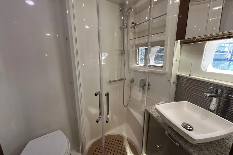  Yacht Photos Pics Luxurious bathroom in 2018 Sea Ray Fly 520 yacht with modern shower and sink.