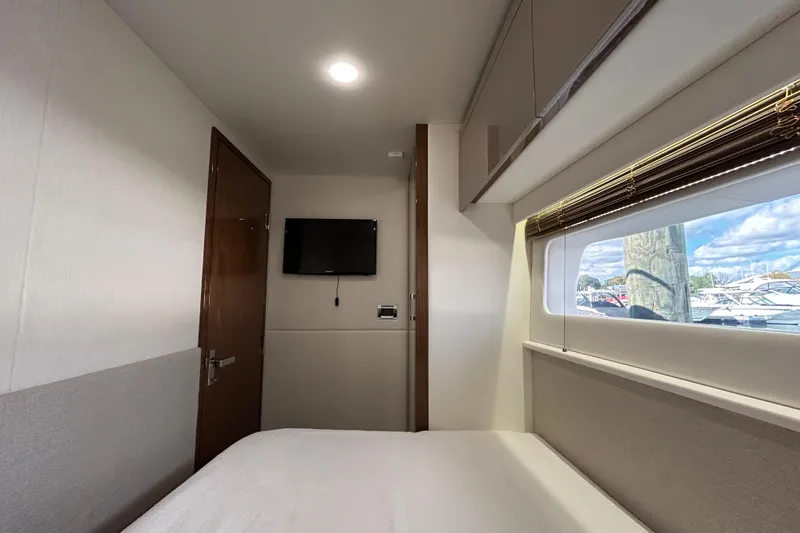  Yacht Photos Pics Interior cabin of 2018 Sea Ray Fly 520 yacht with window view and TV.