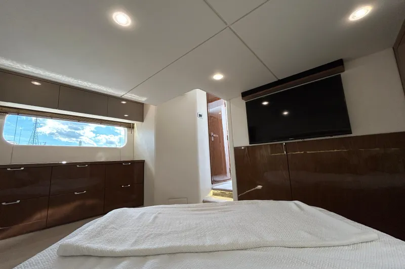  Yacht Photos Pics Luxurious interior of 2018 Sea Ray Fly 520 yacht with modern furnishings and large window.