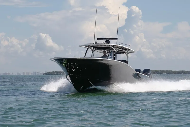  Yacht Photos Pics 2026 Mag Bay 43 CC boat cruising on open water under a clear sky.