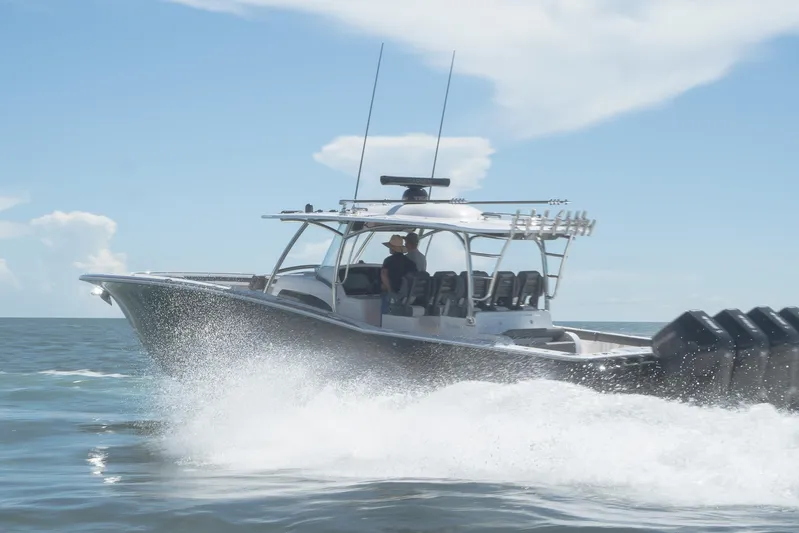  Yacht Photos Pics 2026 Mag Bay 43 CC boat cruising on open water under clear skies.