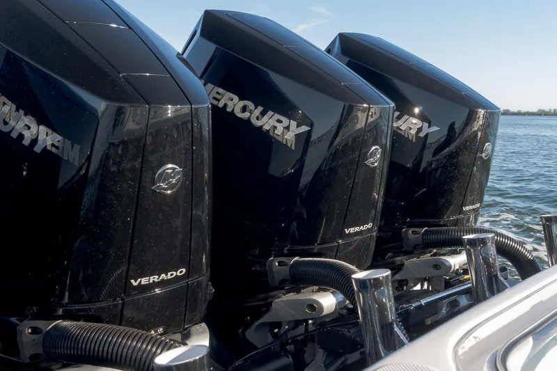  Yacht Photos Pics Triple Mercury Verado engines on a 2026 Mag Bay 43 CC boat, cruising on water.