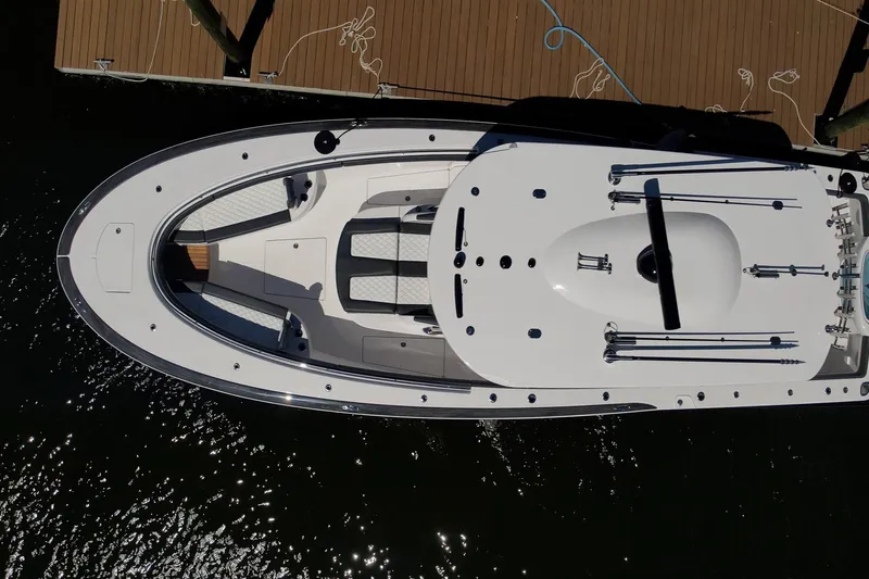  Yacht Photos Pics Overhead view of 2026 Mag Bay 43 CC boat docked, showcasing sleek design and spacious deck.