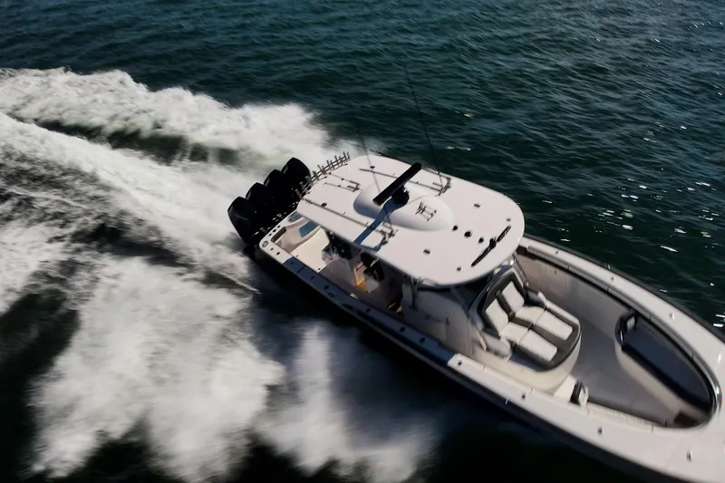  Yacht Photos Pics 2026 Mag Bay 43 CC boat speeding on open water, aerial view.