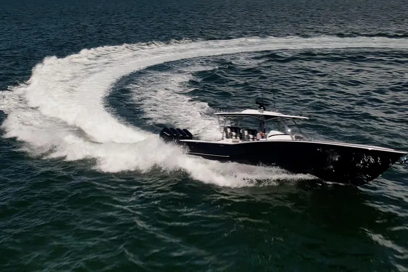  Yacht Photos Pics 2026 Mag Bay 43 CC boat making a sharp turn on open water.