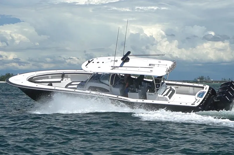  Yacht Photos Pics 2026 Mag Bay 43 CC cruising on open water under cloudy skies.