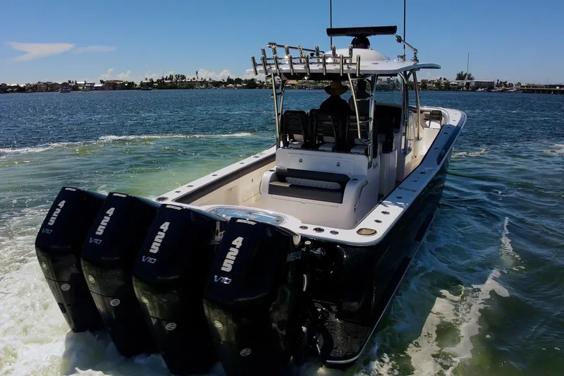 Yacht Photos Pics 2026 Mag Bay 43 CC boat with four powerful outboard engines cruising on water.