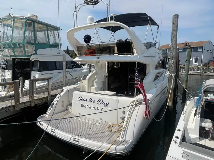  Yacht Photos Pics 2001 Viking Princess 45 Flybridge Sport Cruiser docked at marina, Seas the Day Baldwin, NY.
