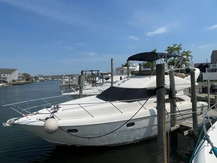  Yacht Photos Pics 2001 Viking Princess 45 Flybridge Sport Cruiser docked at marina.