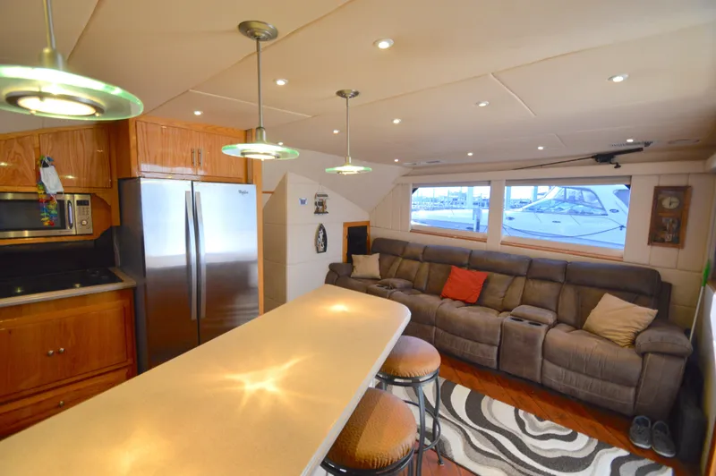Custom Yacht Photos Pics Interior of a 2004 Chesapeake 58 yacht with kitchen and living area.