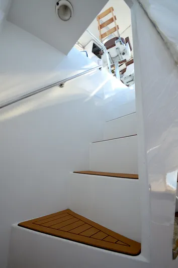 Custom Yacht Photos Pics White staircase on a 2004 Chesapeake 58 boat.