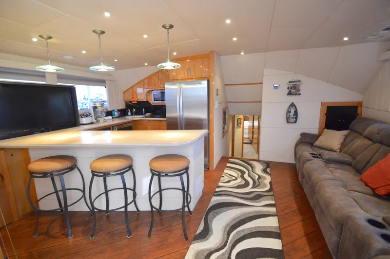 Custom Yacht Photos Pics Interior of a 2004 Chesapeake 58 yacht with modern kitchen and lounge.