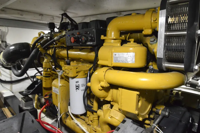Custom Yacht Photos Pics Engine room of a 2004 Chesapeake 58 boat with yellow engine.