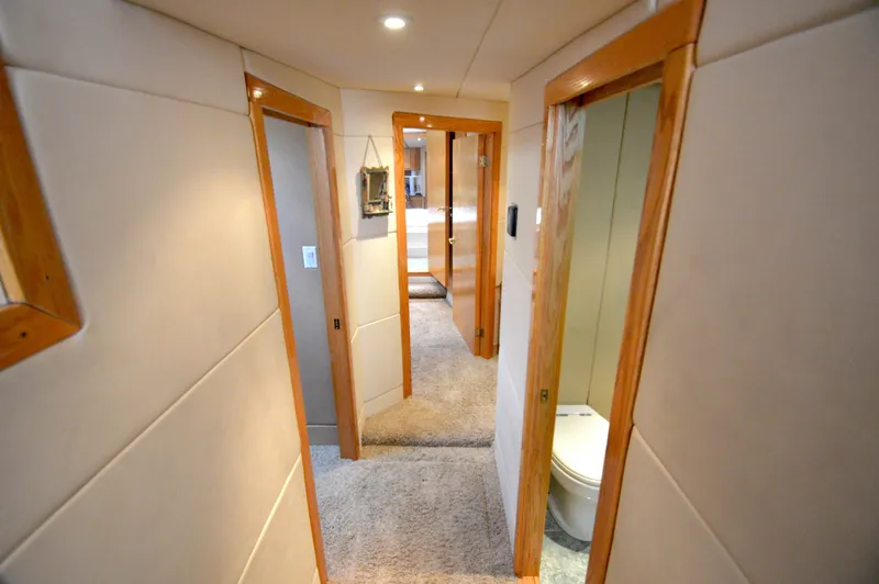 Custom Yacht Photos Pics Interior of a 2004 Chesapeake 58 boat with carpet and wooden doors.