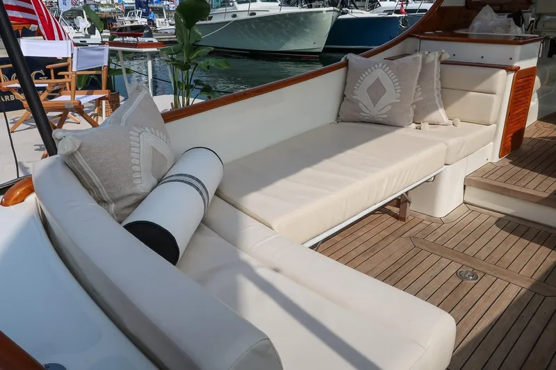 Bristol Yacht Photos Pics Luxurious seating area on 2015 Hinckley Picnic Boat 37 MKIII with elegant cushions and teak flooring.