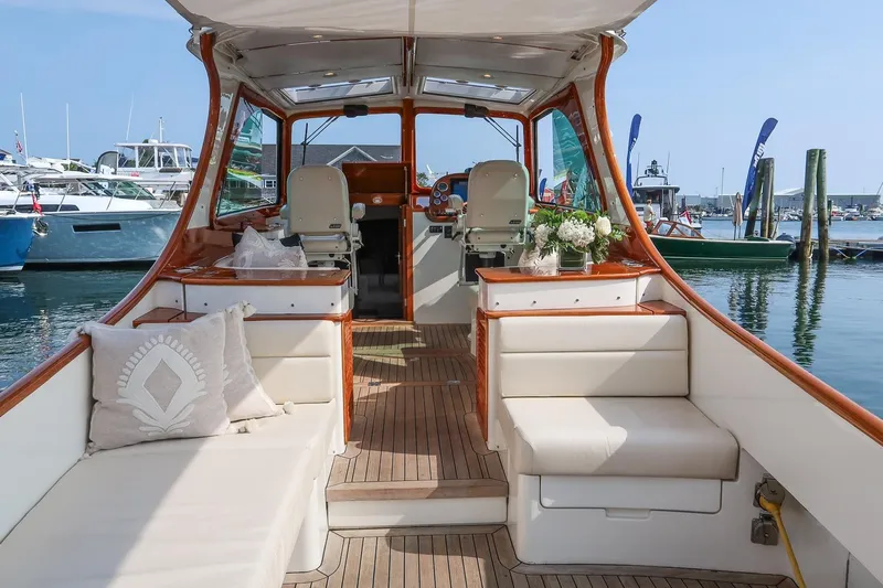 Bristol Yacht Photos Pics Luxurious 2015 Hinckley Picnic Boat 37 MKIII interior with elegant seating and floral decor.