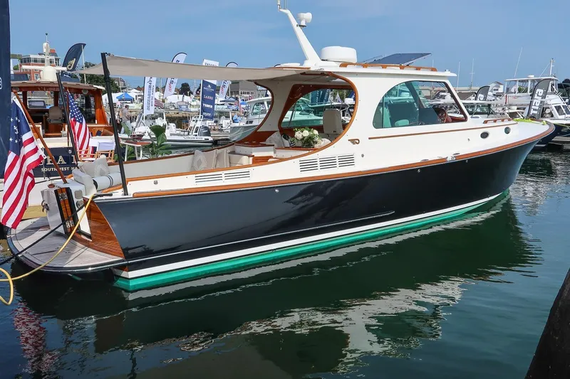 Bristol Yacht Photos Pics 2015 Hinckley Picnic Boat 37 MKIII docked at marina, showcasing elegant design.