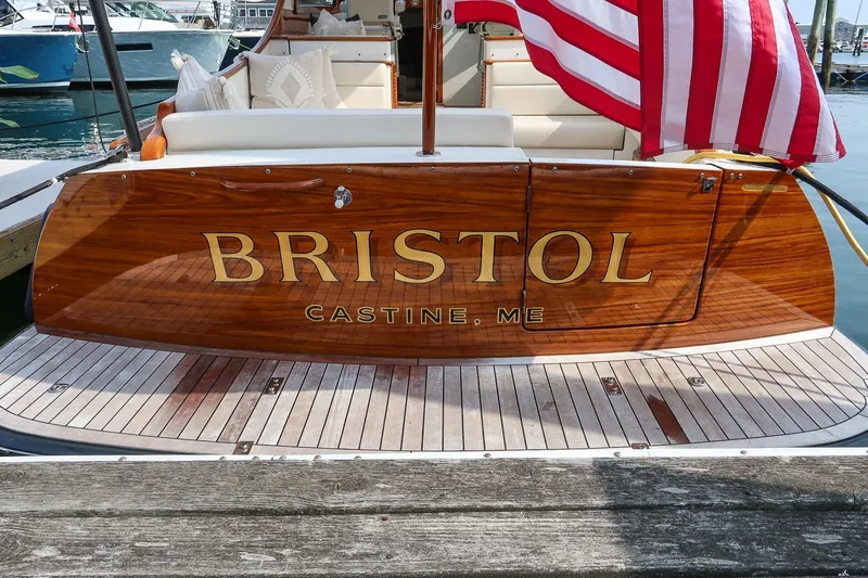 Bristol Yacht Photos Pics Hinckley Picnic Boat 37 MKIII, 2015, docked with American flag, "Bristol" nameplate, Castine, ME.